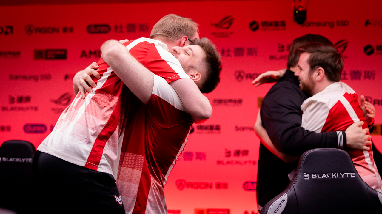 Four Heroic players hugging