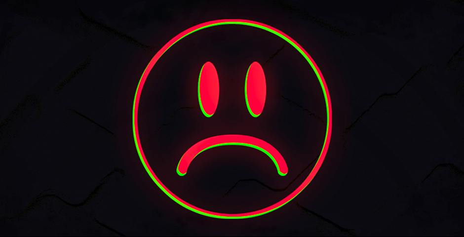 Red unhappy face on green background