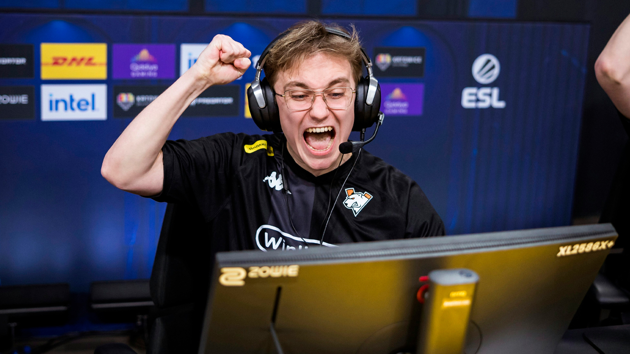 Man celebrating at computer desk