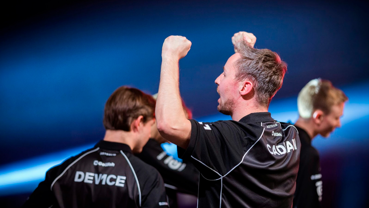 Three men celebrating in black shirts